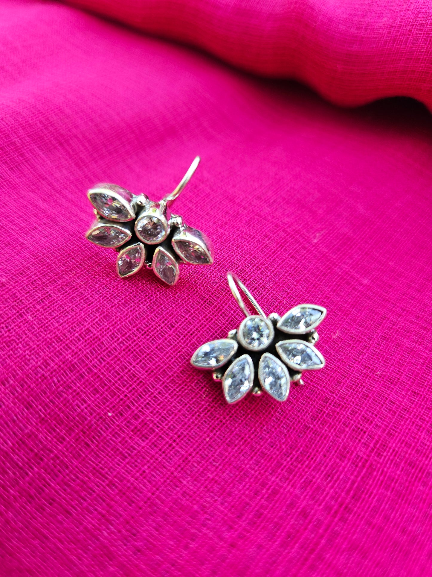 this is a pair of handcrafted 925 sterling silver hook earring in floral petal pattern. Lightweight, easy to wear made in pure silver this silver earring is forever classic. It has indian ethnic feel yet versatile. It makes for a thoughtful silver jewelry gift for women on any occasion.