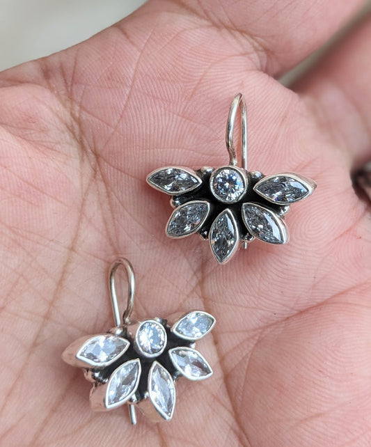 this is a pair of handcrafted 925 sterling silver hook earring in floral petal pattern. Lightweight, easy to wear made in pure silver this silver earring is forever classic. It has indian ethnic feel yet versatile. It makes for a thoughtful silver jewelry gift for women on any occasion.