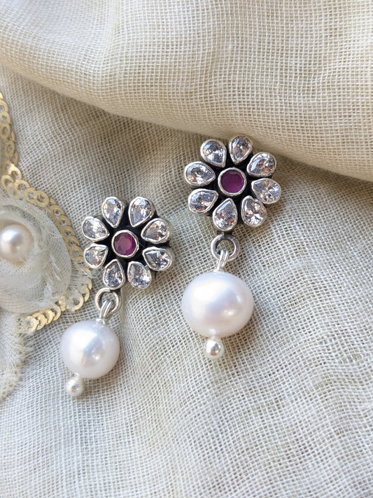 Floral stud of cubic zirconia gemstones with drop of pearl. Handcrafted sterling silver Indian earring.