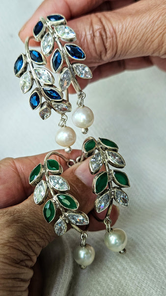 925 Sterling Silver Hoop with Cubic Zirconia Gemstones. Gemstones are designed in a leafy vine form. They add sparkle to this beautiful hoop earring. In addition there is a drop pearl which  adds movement and grace. Made by artisans by hand in Jaipur,India in pure sterling silver. #silverisforever #kevasilver #kevadesign