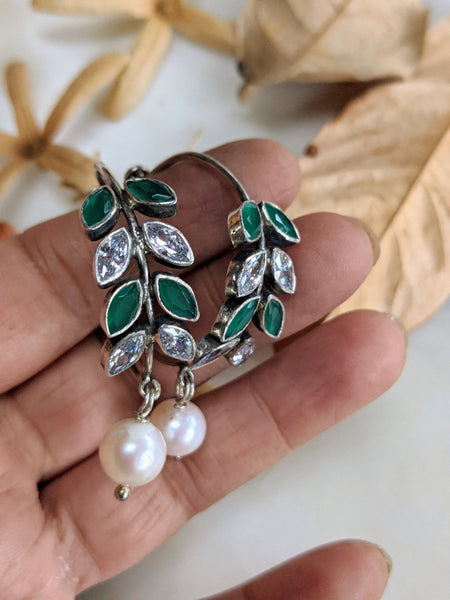 925 Sterling Silver Hoop with Cubic Zirconia Gemstones. Gemstones are designed in a leafy vine form. They add sparkle to this beautiful hoop earring. In addition there is a drop pearl which  adds movement and grace. Made by artisans by hand in Jaipur,India in pure sterling silver. #silverisforever #kevasilver #kevadesign