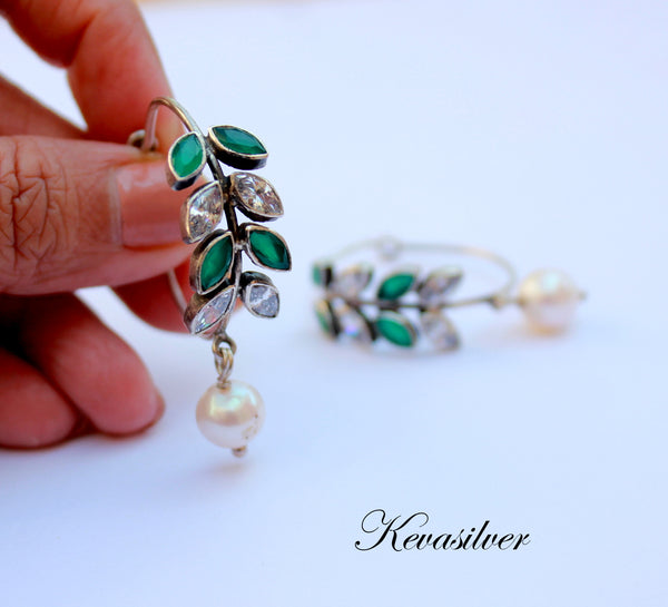 925 Sterling Silver Hoop with Cubic Zirconia Gemstones. Gemstones are designed in a leafy vine form. They add sparkle to this beautiful hoop earring. In addition there is a drop pearl which  adds movement and grace. Made by artisans by hand in Jaipur,India in pure sterling silver. #silverisforever #kevasilver #kevadesign