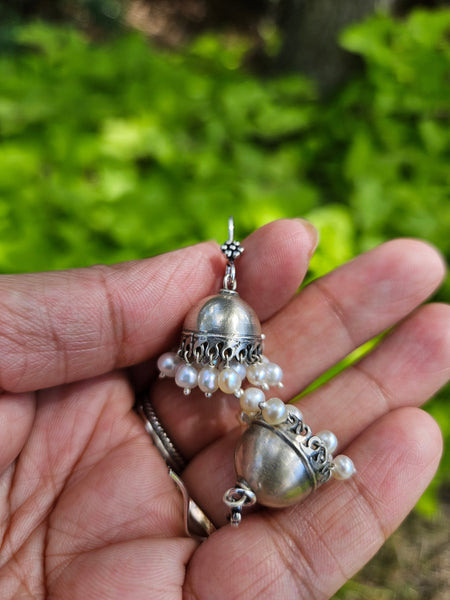 This is a small 925 Sterling Silver Jhumka with pearl drops. Lightweight and very easy to wear with the wire hook. It is made in pure silver by expert craftsmen of Jaipur, India. It is a traditional Indian bell shaped ethnic earring which goes well all Indian attires.