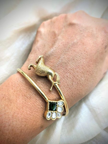 Contemporary pure silver with gold polish horse motif and green stone open bangle