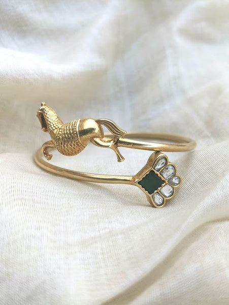 Contemporary pure silver with gold polish horse motif and green stone open bangle