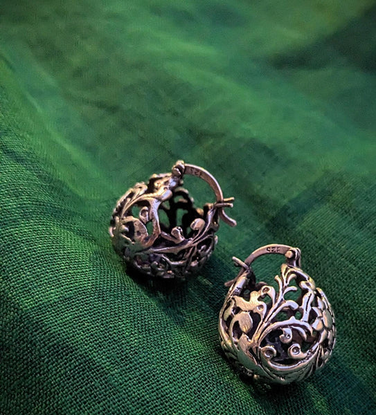925 Sterling silver ball hoop earrings with a delicate floral design. The earrings are made of a filigree pattern and have oxidised finish.