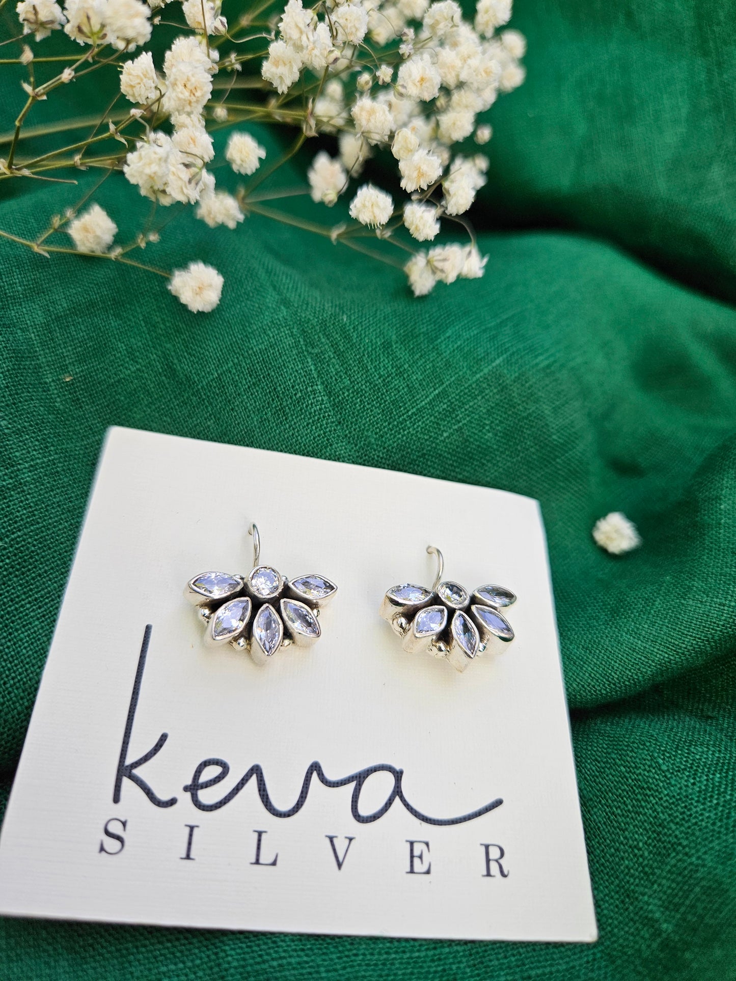 this is a pair of handcrafted 925 sterling silver hook earring in floral petal pattern. Lightweight, easy to wear made in pure silver this silver earring is forever classic. It has indian ethnic feel yet versatile. It makes for a thoughtful silver jewelry gift for women on any occasion. 