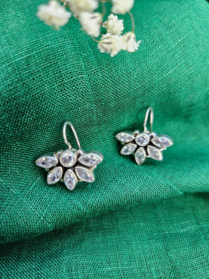 this is a pair of handcrafted 925 sterling silver hook earring in floral petal pattern. Lightweight, easy to wear made in pure silver this silver earring is forever classic. It has indian ethnic feel yet versatile. It makes for a thoughtful silver jewelry gift for women on any occasion. 