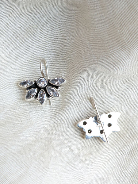 this is a pair of handcrafted 925 sterling silver hook earring in floral petal pattern. Lightweight, easy to wear made in pure silver this silver earring is forever classic. It has indian ethnic feel yet versatile. It makes for a thoughtful silver jewelry gift for women on any occasion. 