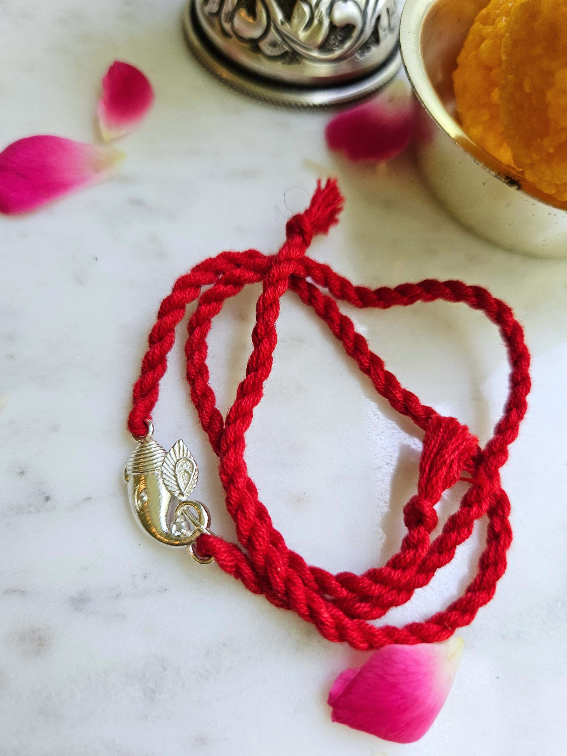 925 sterling silver Ganesha rakhi on red twisted cotton thread