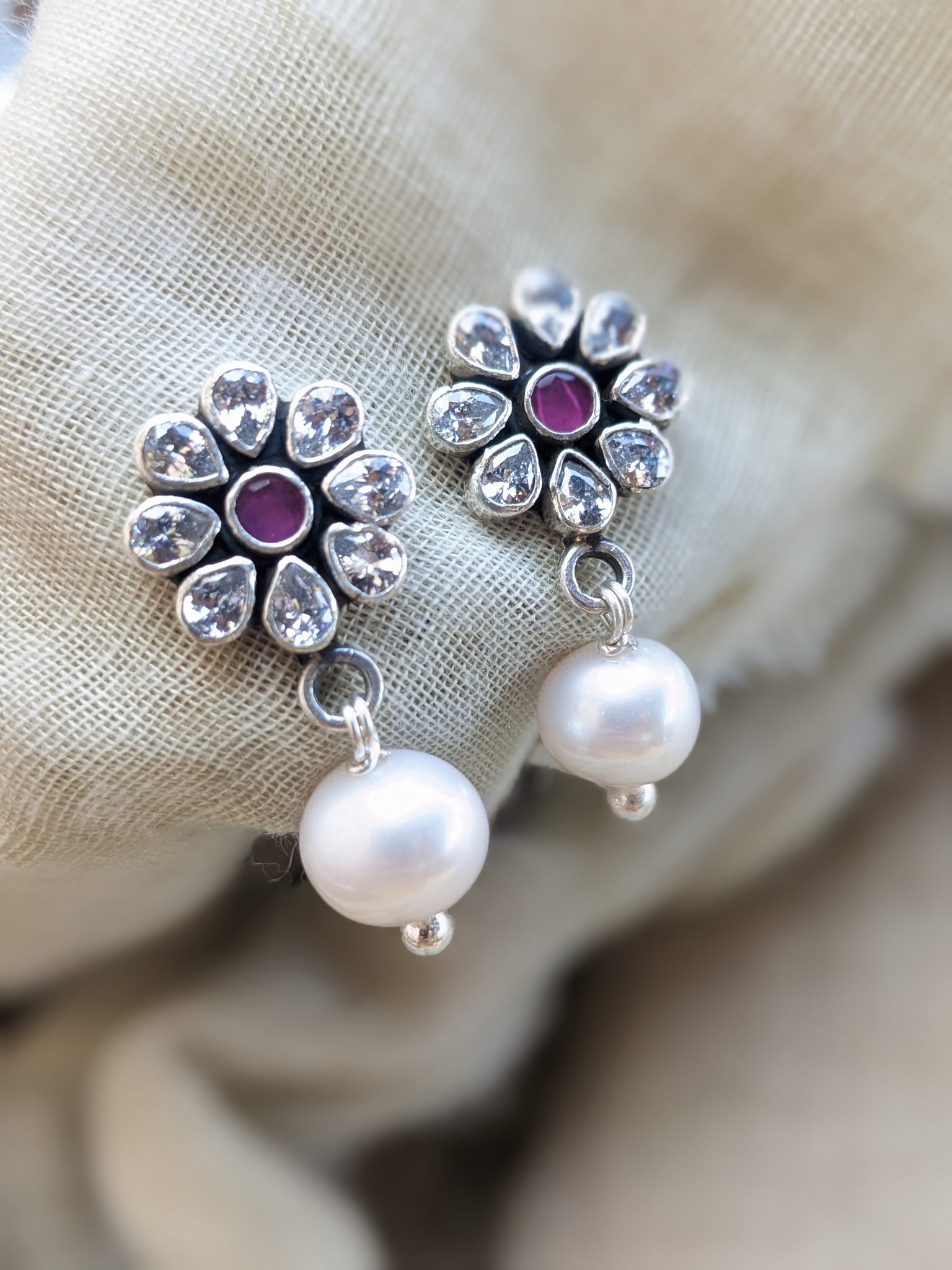Floral stud of cubic zirconia gemstones with drop of pearl. Handcrafted sterling silver  Indian earring.