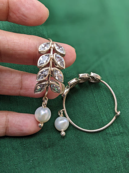 925 Sterling Silver Hoop with Cubic Zirconia Gemstones. Gemstones are designed in a leafy vine form. They add sparkle to this beautiful hoop earring. In addition there is a drop pearl which  adds movement and grace. Made by artisans by hand in Jaipur,India in pure sterling silver. #silverisforever #kevasilver #kevadesign