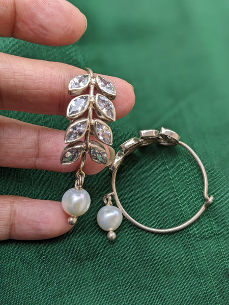925 Sterling Silver Hoop with Cubic Zirconia Gemstones. Gemstones are designed in a leafy vine form. They add sparkle to this beautiful hoop earring. In addition there is a drop pearl which  adds movement and grace. Made by artisans by hand in Jaipur,India in pure sterling silver. #silverisforever #kevasilver #kevadesign