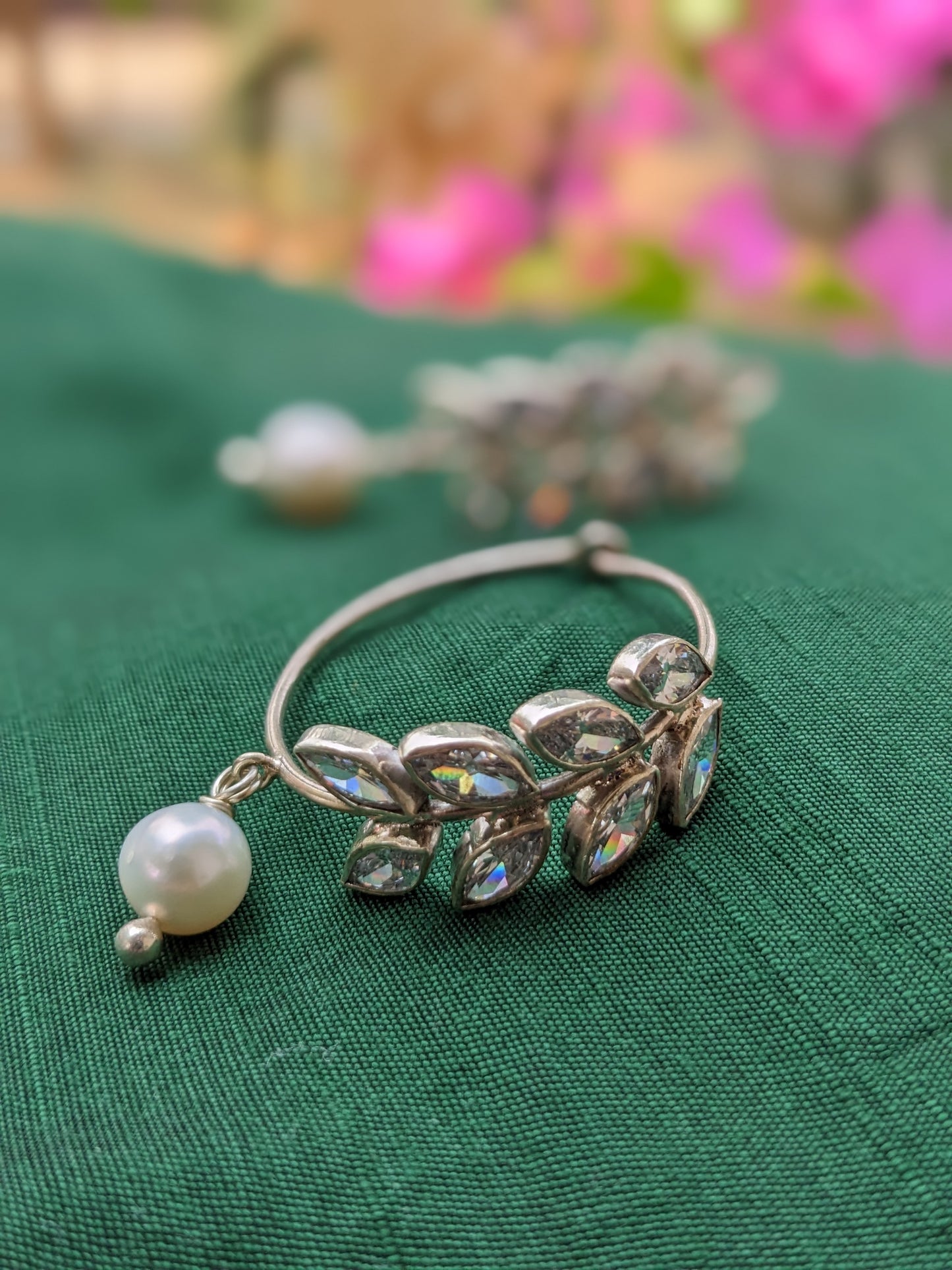 925 Sterling Silver Hoop with Cubic Zirconia Gemstones. Gemstones are designed in a leafy vine form. They add sparkle to this beautiful hoop earring. In addition there is a drop pearl which  adds movement and grace. Made by artisans by hand in Jaipur,India in pure sterling silver. #silverisforever #kevasilver #kevadesign