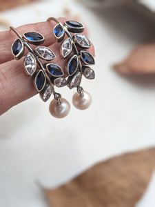 925 Sterling Silver Hoop with Cubic Zirconia Gemstones. Gemstones are designed in a leafy vine form. They add sparkle to this beautiful hoop earring. In addition there is a drop pearl which  adds movement and grace. Made by artisans by hand in Jaipur,India in pure sterling silver. #silverisforever #kevasilver #kevadesign